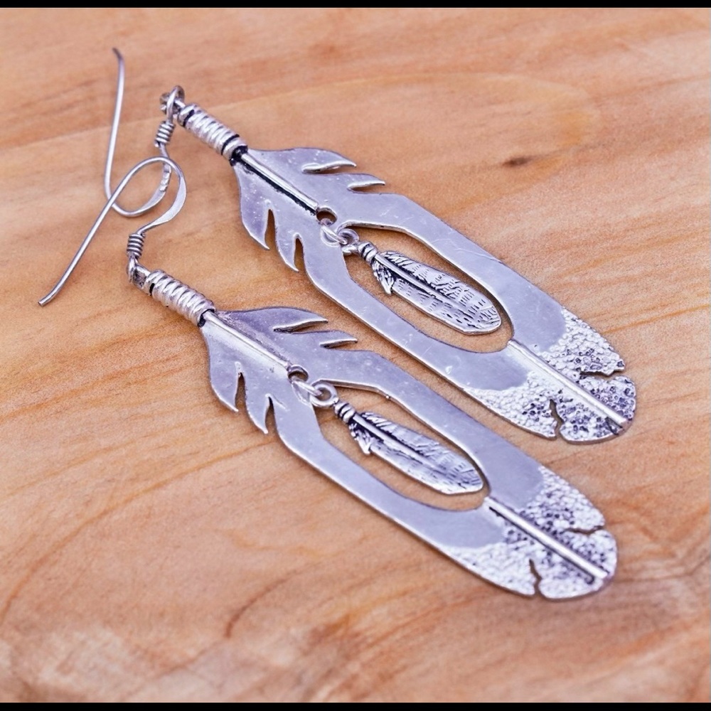 PLEASE HELP ME FIND THESE EARRINGS~Silver feather earrings- marking “SC” on back